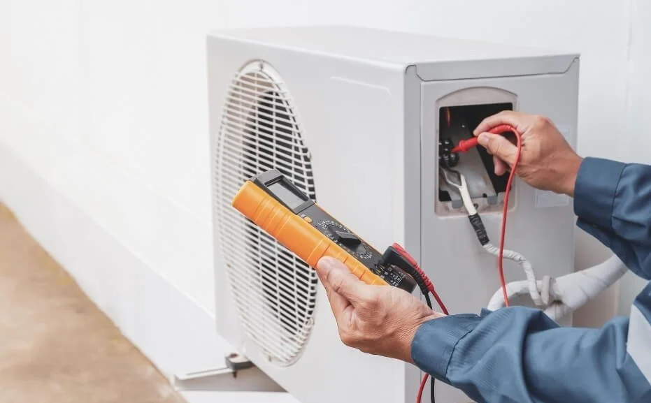 technician testing AC system